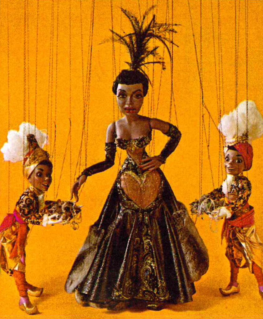Color photograph of Pearl Bailey puppet and two shorter masculine puppets from Sid and Marty Krofft's Les Poupées de Paris puppet show at Hemisfair '68